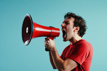 Man holds red megaphone in mouth, hands raised in protest, crowds gathered, city skyline in background.