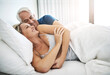 © CamPen2000/peopleimages.com - Cuddle, mature or happy couple resting in bed in home for marriage, commitment or loyalty to partner. Morning, love or senior people lying for support with romance, care or trust for bonding together