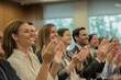 © Store - Happy audience clapping at business presentation