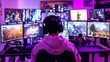 © gankevstock - Video game streamer in custom gaming setup with multiple screens