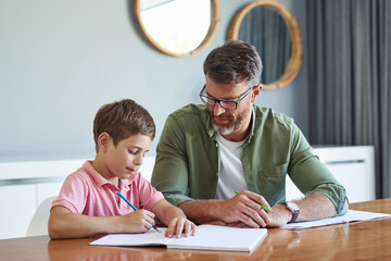 Poster - Education, homework or writing with father and son at dining room table of home for learning or study. Book, homeschool or scholarship with single parent man and student boy child in apartment