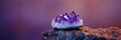© Viktor - A purple rock with a smaller, identical one atop it against a backdrop of larger purple rocks