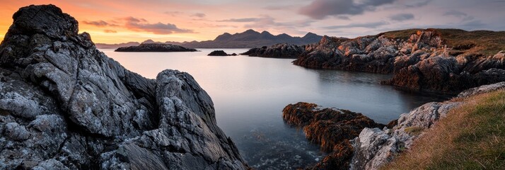 Wall Mural -  A large body of water is enclosed by rocks, with a grassy expanse lying beyond it on the other side