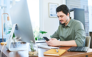 Canvas Print - Computer, phone and business man in office typing for social media, networking and communication. Creative company, professional and person on smartphone for online chat, internet and website at desk