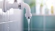 © Cheewynn - Dynamic shot of a leaking pipe in a bathroom, with water escaping forcefully, symbolizing household emergencies and the need for professional plumbing services
