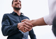 © FotoPush/peopleimages.com - Businessman, handshake and meeting with deal in studio for teamwork, agreement or welcome on a white background. Closeup, business people and shaking hands with colleague for greeting or partnership
