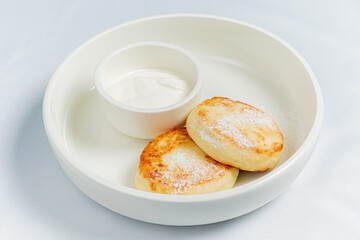 Wall Mural - cottage cheese pancakes with sour cream