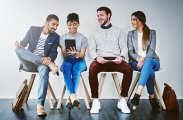 Canvas Print - Group, job interview and row in waiting room, tablet and recruitment for business and appointment. Line, process and opportunity for applicant, chair and employment for people or happy for onboarding