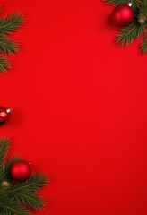 Christmas background with fir decorations and red baubles on red background