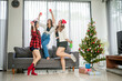 © Odua Images - group of females raising glasses at christmas party