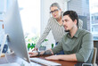 © Frank Coop/peopleimages.com - Computer, advice and support with manager for training an employee in office at workplace. Technology, teamwork and help with female leader or supervisor at desk for assistance or coaching at new job