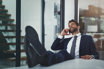 Poster - Phone call, business man and legs on table, talking and finish deal to relax in office. Mobile, worker and feet on desk on break for chat, laugh or happy salesman listen to funny joke in negotiation
