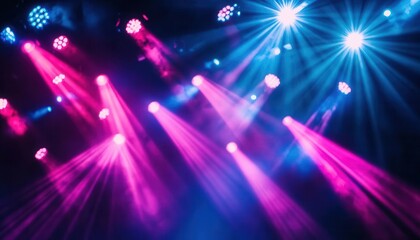 Wall Mural - blue and pink stage lights on dark background