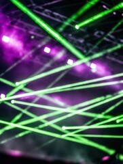 Wall Mural - abstract green and purple laser lights on stage