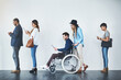 © Koegelenberg Coop/peopleimages.com - Employment, people or waiting in office for recruitment with inclusion, tech or company hiring. Group diversity, candidates or man with disability in line for equality at interview at human resources