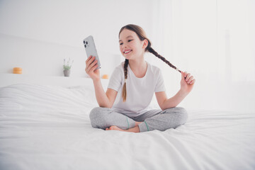 Poster - Portrait of cute adorable cheerful girl chatting enjoying free time cosy apartment white light room interior indoors