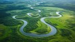 © somsri - Serene Aerial View of a Winding River in Green Landscape