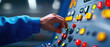 © Wonderful Studio - Hand adjusting control panel in a modern industrial environment