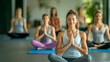 © Valeri - group of women doing yoga indoors