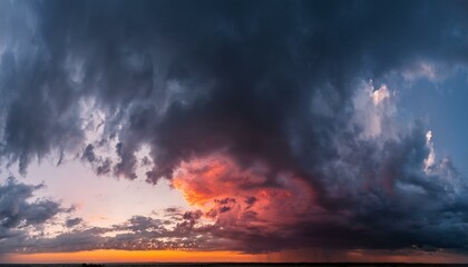 Wall Mural - wide panoramic view of the dark dramatic stormy sky with cumulus clouds and crimson glow sad cloudscape overcast