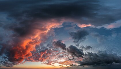 Wall Mural - wide panoramic view of the dark dramatic stormy sky with cumulus clouds and crimson glow sad cloudscape overcast