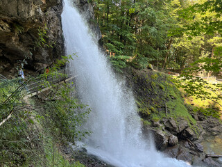 Wall Mural - Giessbach Falls in the eponymous nature park and over Lake Brienz - Giessbachfälle (Giessbachfaelle) im gleichnamigen Naturpark und über dem Brienzersee-Canton of Bern, Switzerland (Schweiz)