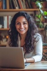 Poster - woman sitting at a table with a laptop, focused on her work