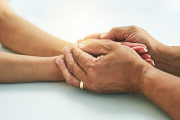 Canvas Print - Doctor, people and holding hands for counseling in hospital, kindness and support for medical news. Physician, patient and help with diagnosis consultation, compassion and specialist for respect