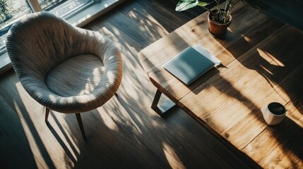 Wall Mural - A cozy living space featuring a chair, wooden table, notebook, and a coffee cup.