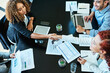 © SensSai/peopleimages.com - Office, above and business people in meeting with handshake, partnership and teamwork for project. Boardroom, employees and accountants with shaking hands for b2b agreement, investment deal and smile