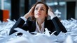 © Noppakun - Businesswoman Overwhelmed by Paperwork Chaos