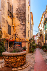 Typical street with a well, in La Turbie, a medieval village, in the Alpes Maritimes, in Provence Alpes Côte d'Azur, France.