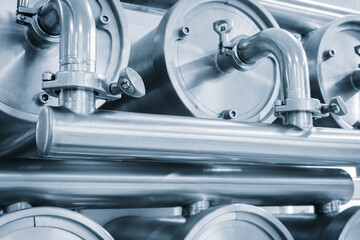 Poster - Machine for the production of dairy products with a series of metal stainless steel cylinders and pipes with silver trim. cylinders are connected to each other and appear to be part of a larger system