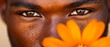 © Albert - A close-up of a man's face with a flower in front of it