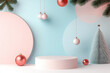 © vejaa - Christmas composition with empty mockup podium platform for product presentation. Blank podium stand, mini Christmas tree and decorations on geometric pale pink and pastel blue background. Front view