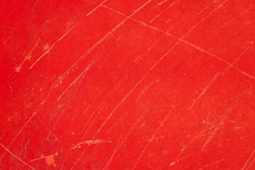 Wall Mural - A red background with a red line on it. The line is very thin and it looks like it has been scratched