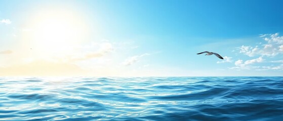 Wall Mural -  Bird flies over tranquil water, blue sky above, sun at sky's heart