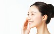 © Vivid_Vision - A graceful Chinese woman in her late 30s  smiling gently and softly touching her chin, skin care concept