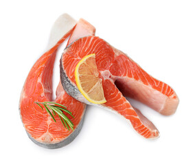 Two fresh salmon steaks, lemon and rosemary isolated on white, above view