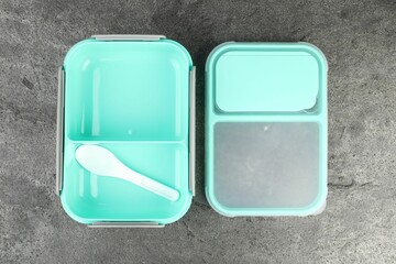 Wall Mural - Empty plastic lunch box with cutlery on grey table, top view