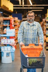 Senior man at grocery store products