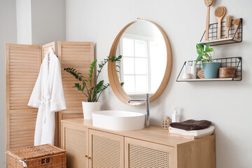 Canvas Print - Modern sink, chest of drawers, folding screen and laundry basket in interior of bathroom