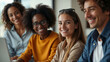 © mischenko - A group of people of different nationalities smiling and collaborating in a brightly lit office space, symbolizing inclusivity and teamwork.