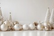 © Gatherina - Christmas ornaments and white trees creating festive atmosphere on white background
