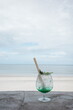 © Magwin - Glass on terrace against blue sea. Cool drink on hot sunny day in cafe by the sea