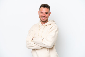 Wall Mural - Young caucasian handsome man isolated on white background with arms crossed and looking forward