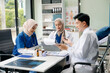 © Nuttapong punna - Doctors and nurses working together in a hospital ward, showcasing professionalism, teamwork