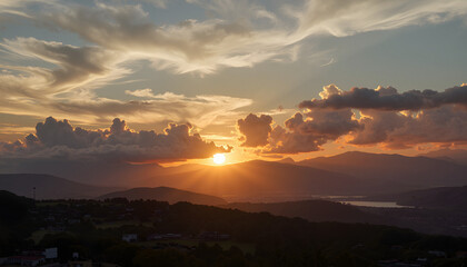scenic sunset over mountains with dramatic clouds.