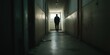 © gunzexx png and bg - A silhouetted figure walks alone in a dimly lit hallway, heading towards a single glowing window at the end, evoking feelings of solitude and introspection.