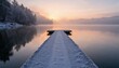 © Tatyana - Serene winter sunrise over a frozen lake with wooden pier, tranquil landscape